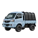 A silver blue truck with a canopy