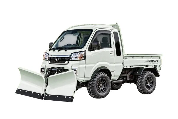 A kei truck fitted with a snow plow